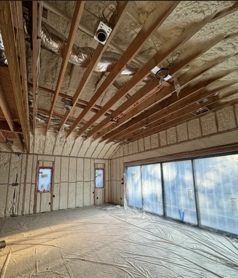 Interior walls and ceiling insulated with spray foam during new construction in Chisago City